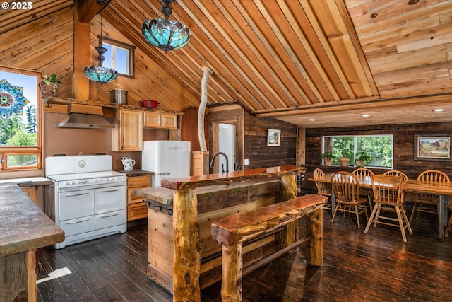 kitchen with white appliances, wood walls, wood ceiling, dark wood-style flooring, and under cabinet range hood