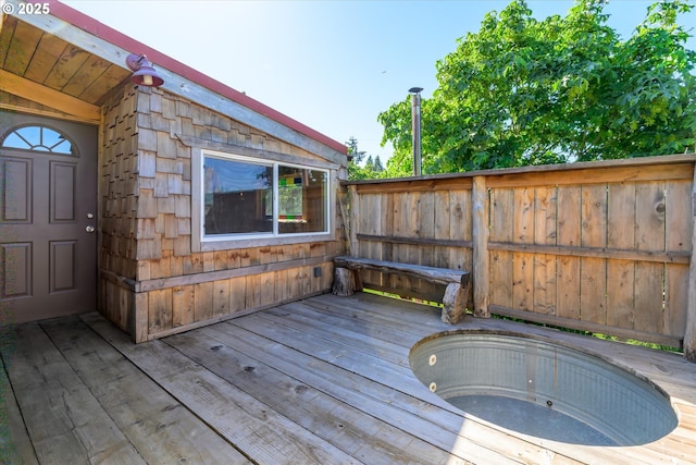 wooden deck featuring fence