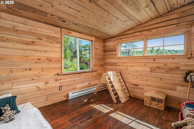 bedroom featuring lofted ceiling, wood-type flooring, wood walls, and a baseboard radiator