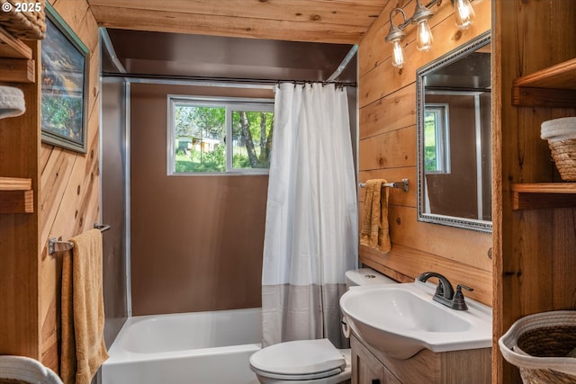 bathroom with vanity, shower / tub combo, and toilet