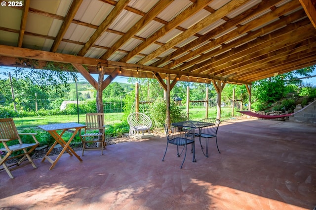 view of patio featuring outdoor dining area