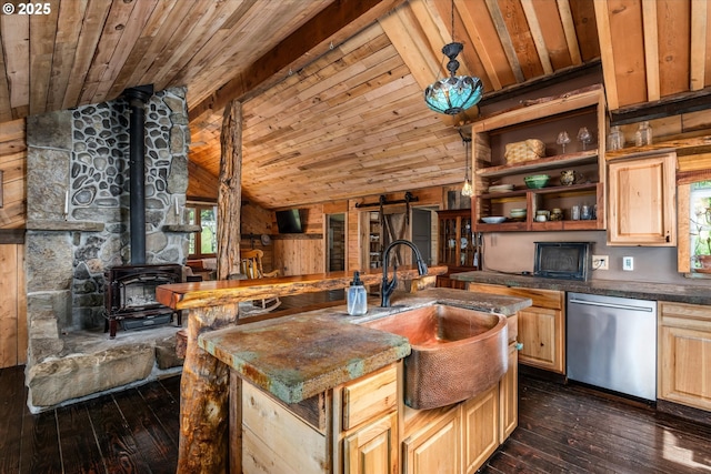 kitchen featuring stainless steel dishwasher, wooden ceiling, a sink, a wood stove, and plenty of natural light