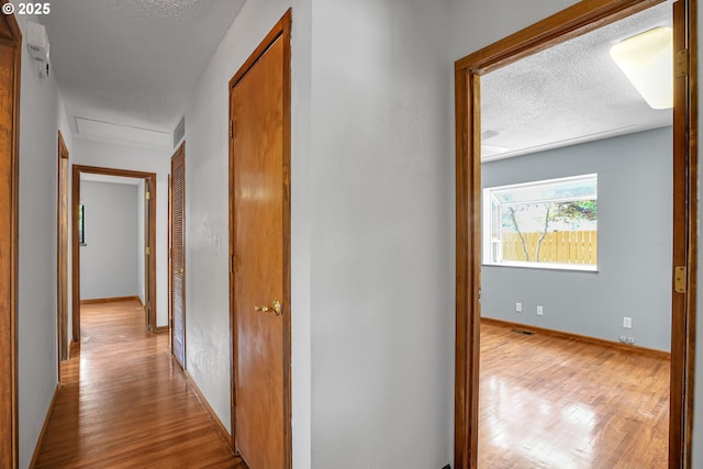 904 SE 223rd Ave, Gresham, OR 97030 - hallway with wood finished floors and a textured ceiling