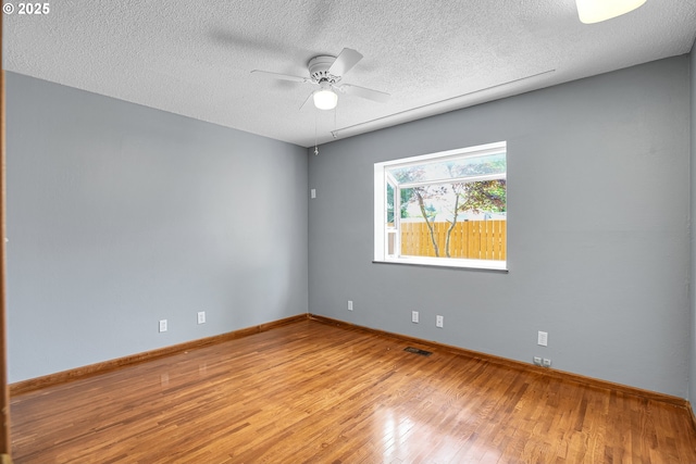 904 SE 223rd Ave, Gresham, OR 97030 - unfurnished room featuring wood finished floors, ceiling fan, and a textured ceiling