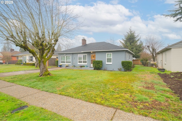 view of front of home with a front lawn