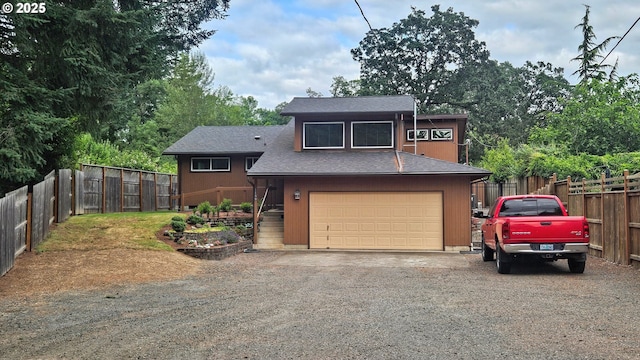 1159 Fir Acres Dr, Eugene, OR 97401 - split level home with an attached garage, driveway, and roof with shingles