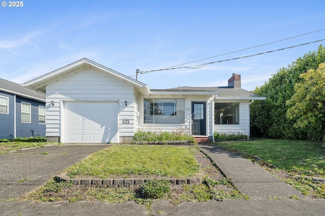 1806 8th St, Tillamook, OR 97141 - ranch-style home with a garage, a chimney, a front lawn, and aphalt driveway