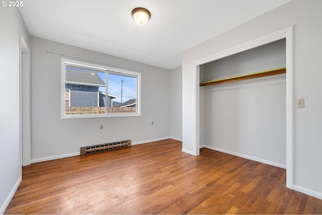1806 8th St, Tillamook, OR 97141 - unfurnished bedroom with a closet, baseboards, and wood finished floors