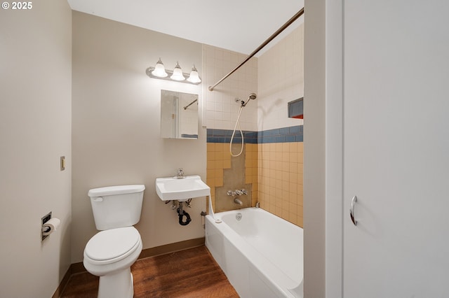 1806 8th St, Tillamook, OR 97141 - bathroom with a sink, toilet, baseboards, tub / shower combination, and wood finished floors