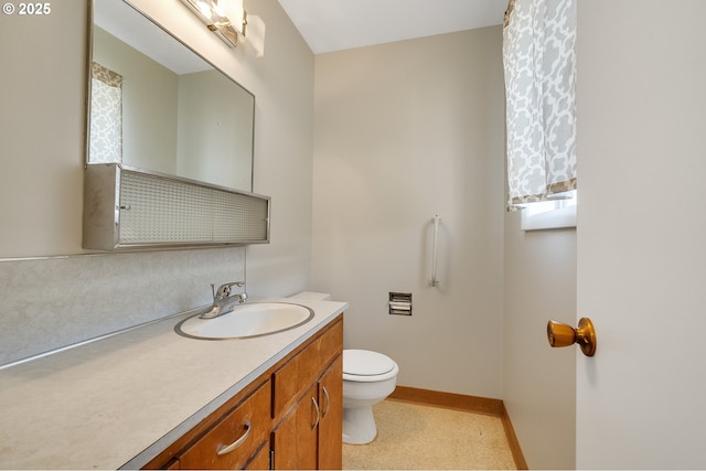 1806 8th St, Tillamook, OR 97141 - half bathroom with vanity, baseboards, and toilet