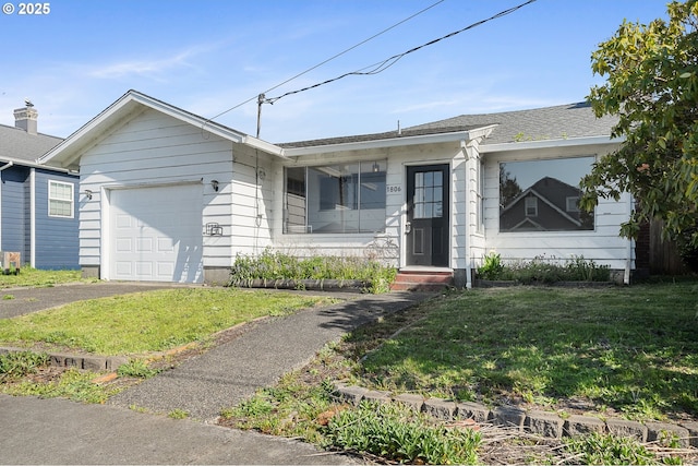 1806 8th St, Tillamook, OR 97141 - ranch-style home with a garage, driveway, and a front lawn