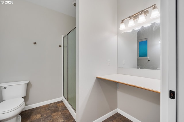 1806 8th St, Tillamook, OR 97141 - full bathroom featuring baseboards, stone finish floor, a shower stall, and toilet