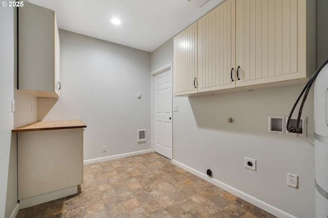 1806 8th St, Tillamook, OR 97141 - laundry room with visible vents, baseboards, cabinet space, stone finish flooring, and hookup for an electric dryer