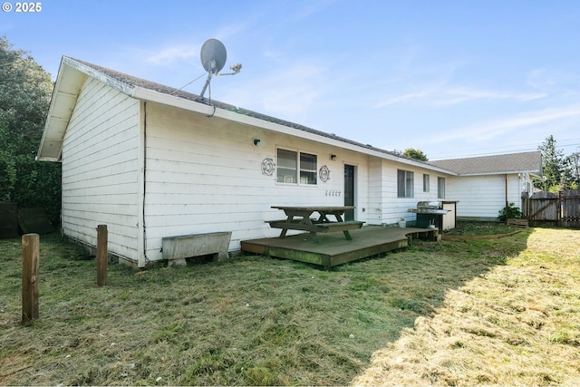 1806 8th St, Tillamook, OR 97141 - rear view of house featuring fence, a yard, and a deck