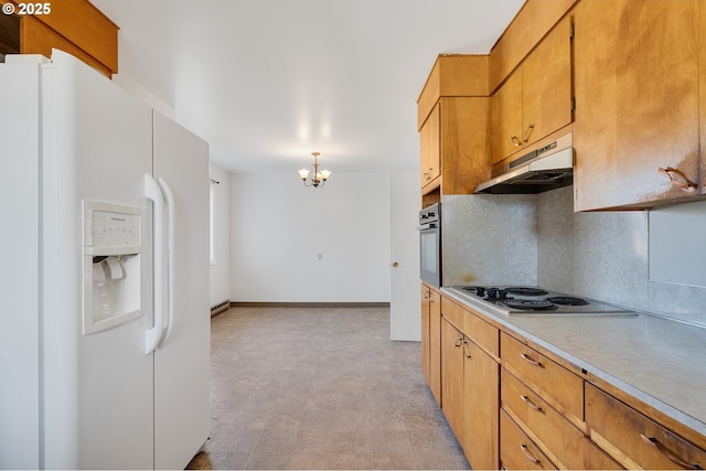 1806 8th St, Tillamook, OR 97141 - kitchen featuring a chandelier, under cabinet range hood, electric cooktop, white fridge with ice dispenser, and stainless steel oven