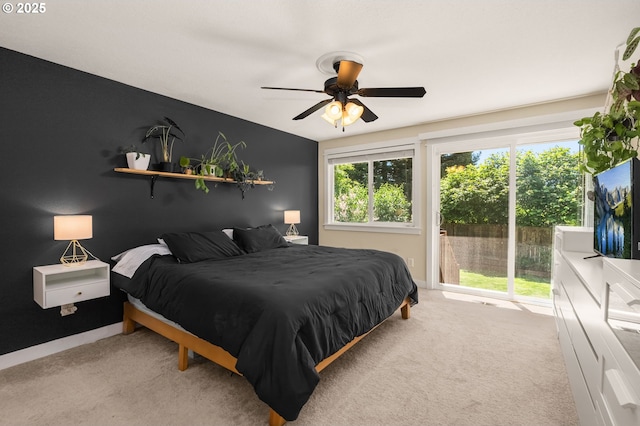 bedroom featuring access to exterior, carpet, and ceiling fan