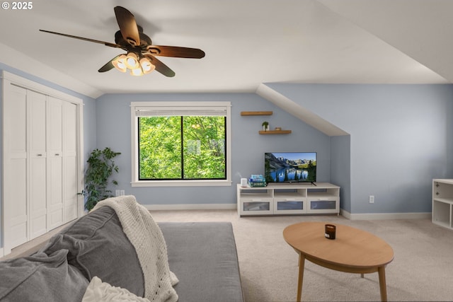 living area with carpet floors, ceiling fan, baseboards, and lofted ceiling