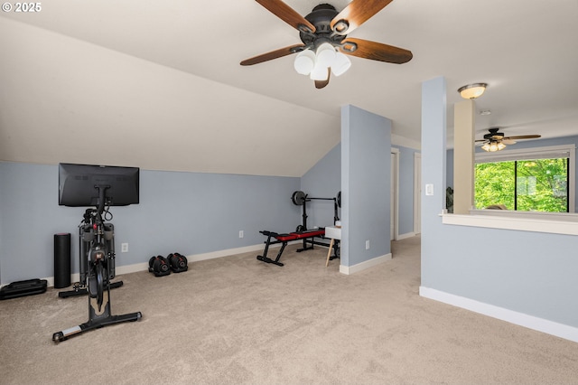 workout room featuring a ceiling fan, carpet floors, vaulted ceiling, and baseboards