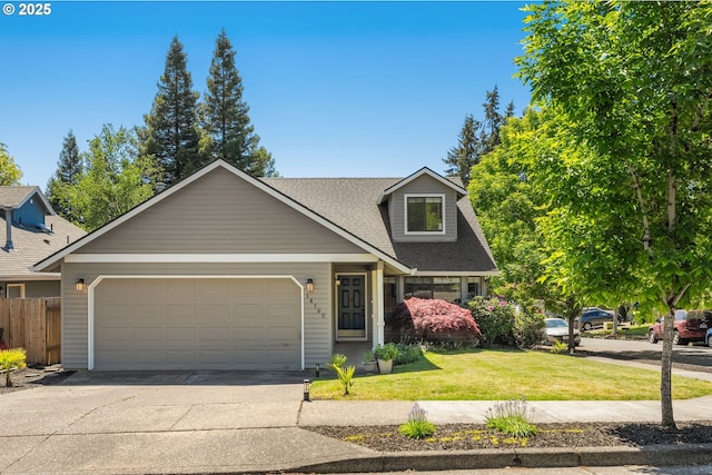 view of front facade with an attached garage, concrete driveway, and roof with shingles