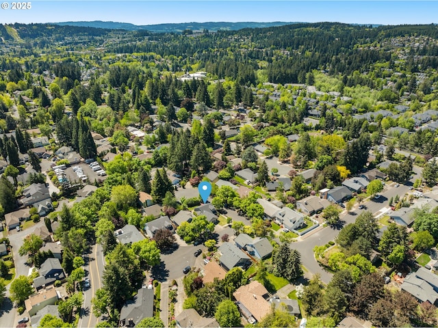 aerial view of residential area with a heavily wooded area