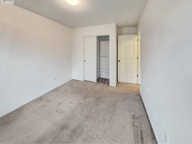 21069 SW Madeira Ter, Sherwood, OR 97140 - unfurnished bedroom featuring carpet, a closet, and a textured ceiling