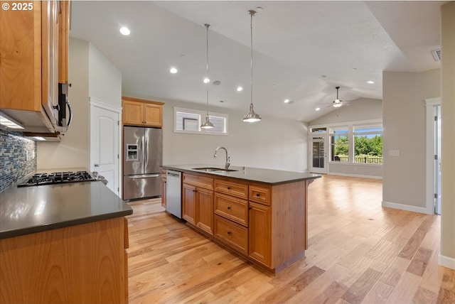 5809 NW 26th Ave, Camas, WA 98607 - kitchen with appliances with stainless steel finishes, dark countertops, ceiling fan, lofted ceiling, and tasteful backsplash