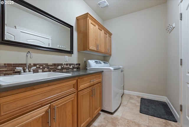 5809 NW 26th Ave, Camas, WA 98607 - laundry room with cabinet space, washing machine and dryer, and light tile patterned floors