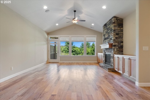 5809 NW 26th Ave, Camas, WA 98607 - unfurnished living room featuring a ceiling fan, vaulted ceiling, a stone fireplace, light wood-style flooring, and recessed lighting