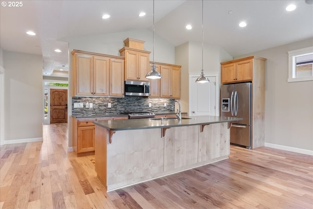 5809 NW 26th Ave, Camas, WA 98607 - kitchen with stainless steel appliances, dark countertops, plenty of natural light, backsplash, and lofted ceiling
