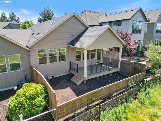 5809 NW 26th Ave, Camas, WA 98607 - back of house featuring a shingled roof, a fenced backyard, and a wooden deck