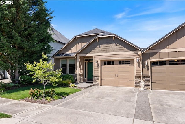 5809 NW 26th Ave, Camas, WA 98607 - view of front of property featuring board and batten siding, driveway, an attached garage, and stone siding