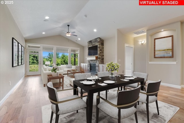 5809 NW 26th Ave, Camas, WA 98607 - dining space featuring ceiling fan, a fireplace, light wood-style flooring, recessed lighting, and high vaulted ceiling