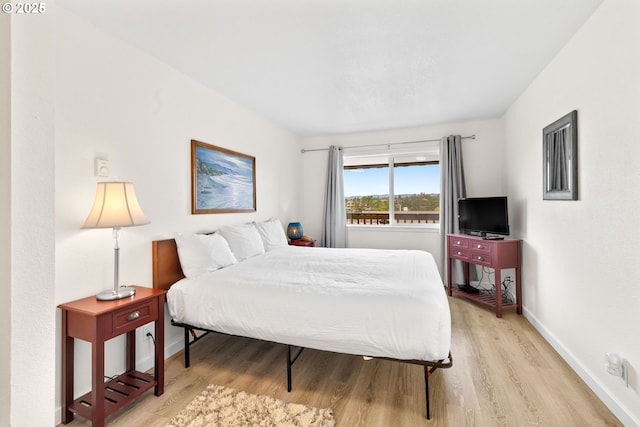 304 14th St NW Unit 304, Long Beach, WA 98631 - bedroom featuring light wood-style floors and baseboards