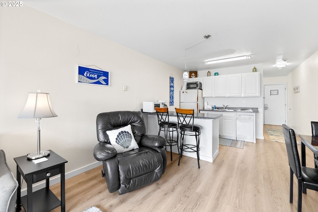 304 14th St NW Unit 304, Long Beach, WA 98631 - sitting room featuring light wood finished floors and baseboards