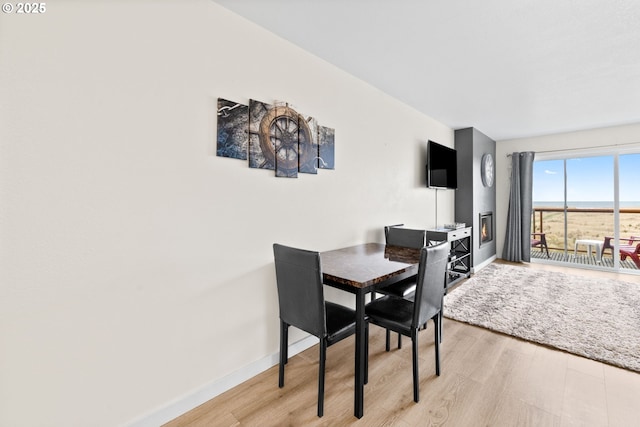 304 14th St NW Unit 304, Long Beach, WA 98631 - dining space with light wood-style floors and baseboards