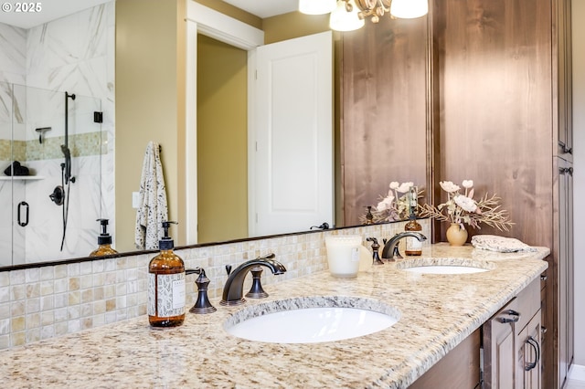 7705 NW Quinault St, Camas, WA 98607 - bathroom featuring a sink, tasteful backsplash, a marble finish shower, and double vanity