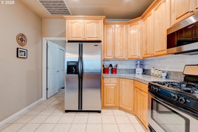 16710 NE 5th St, Vancouver, WA 98684 - kitchen featuring stainless steel appliances, light brown cabinetry, tasteful backsplash, light tile patterned floors, and baseboards
