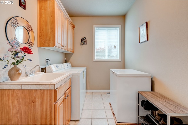 16710 NE 5th St, Vancouver, WA 98684 - washroom featuring washing machine and clothes dryer, cabinet space, light tile patterned floors, and baseboards