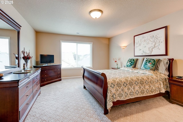 16710 NE 5th St, Vancouver, WA 98684 - bedroom featuring light colored carpet, a textured ceiling, and baseboards