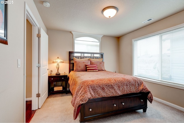 16710 NE 5th St, Vancouver, WA 98684 - bedroom with light carpet, baseboards, and a textured ceiling