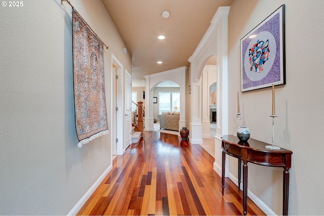 16710 NE 5th St, Vancouver, WA 98684 - hallway featuring arched walkways, wood finished floors, recessed lighting, and baseboards