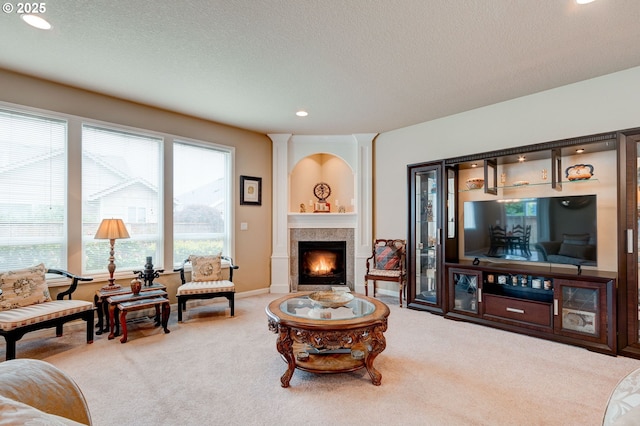 16710 NE 5th St, Vancouver, WA 98684 - carpeted living room featuring recessed lighting, a lit fireplace, a textured ceiling, and baseboards