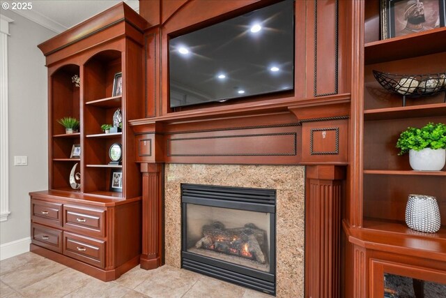 904 NE 224th Cir, Ridgefield, WA 98642 - detailed view of ornamental molding, a fireplace, built in features, and baseboards
