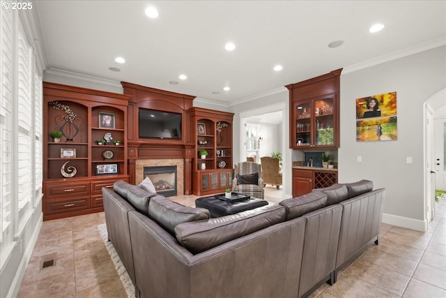 904 NE 224th Cir, Ridgefield, WA 98642 - living area with a premium fireplace, recessed lighting, light tile patterned flooring, crown molding, and baseboards