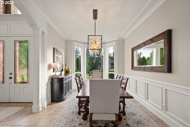 904 NE 224th Cir, Ridgefield, WA 98642 - dining area with a chandelier, a decorative wall, crown molding, decorative columns, and wainscoting