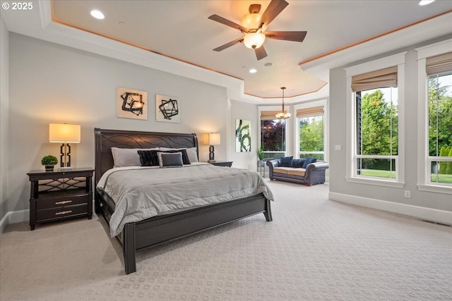 904 NE 224th Cir, Ridgefield, WA 98642 - carpeted bedroom featuring baseboards, recessed lighting, a raised ceiling, a ceiling fan, and a chandelier