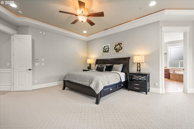 904 NE 224th Cir, Ridgefield, WA 98642 - carpeted bedroom with recessed lighting, baseboards, a tray ceiling, connected bathroom, and ceiling fan