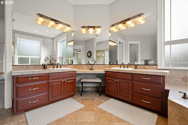 904 NE 224th Cir, Ridgefield, WA 98642 - bathroom with healthy amount of natural light, vanity, and a bathtub