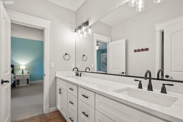 904 NE 224th Cir, Ridgefield, WA 98642 - ensuite bathroom with double vanity, ceiling fan, and baseboards