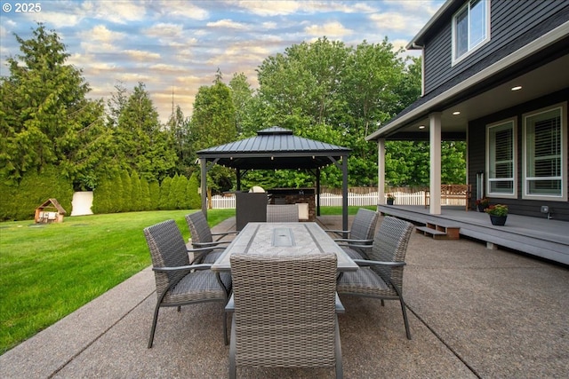 904 NE 224th Cir, Ridgefield, WA 98642 - patio terrace at dusk with a gazebo, outdoor dining area, a patio area, and view of scattered trees